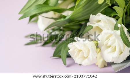 White roses bouquet on color background. Text space