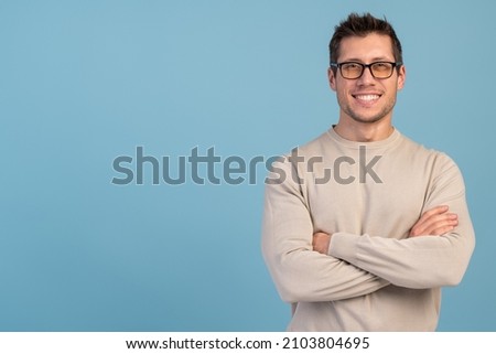 Portrait of nice-looking attractive masculine cheerful bearded guy folded arms isolated over light blue pastel background 