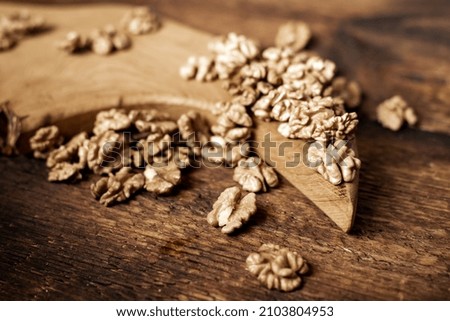 Peeled walnuts. On a wooden board. Healthy food. Natural background.