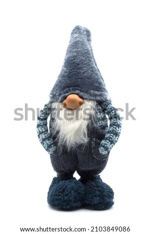 Closeup of blue christmas gnome standing on white background