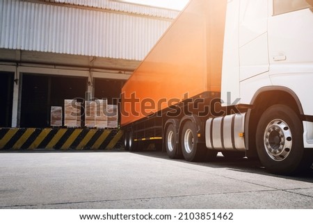 Semi Trailer Trucks with Cargo Container Parked Loading at Dock Warehouse. Shipment. Delivery Lorry Truck. Packaging Boxes Supply Chain. Shipping Warehouse Cargo Freight Truck Transport Logistics.	
 Royalty-Free Stock Photo #2103851462