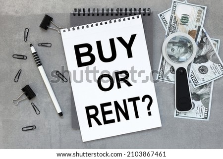 Buy or rent. text on open notepad on gray background business concept