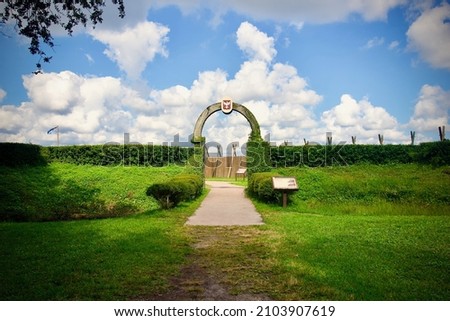 Fort Caroline National Memorial is a reconstruction of Fort de la Caroline, an attempted French colonial settlement in Florida on St. Johns River. Entrance arch. Timucuan Ecological Historic Preserve. Royalty-Free Stock Photo #2103907619