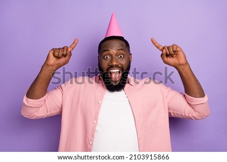 Photo of hooray millennial beard man index up wear cap pastel shirt isolated on purple color background