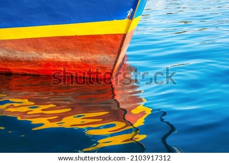 Abstract marine background. Multi-colored bright reflection of old sea ship in the water.