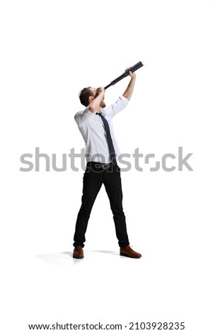 Man, employee looking in a spyglass in search of new working inspiration and ideas isolated over white background. Concept of career, professional and personal growth, motivation, success and ad Royalty-Free Stock Photo #2103928235
