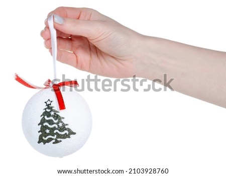Christmas toy ball in hand on white background isolation