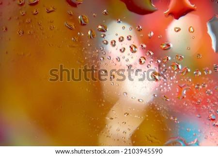 Colorful blurred background with water drops. Closeup.