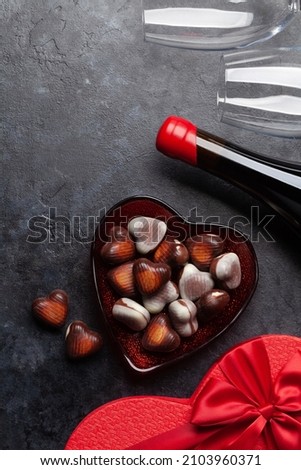 Valentines day heart gift box, wine and chocolate. Top view flat lay with copy space