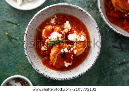 Roasted shrimps with tomatoes and feta cheese