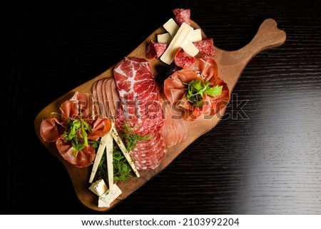 Appetizers table with differents antipasti, charcuterie, snacks and cheese. Buffet party. Top view, flat lay, copy space, negative space Royalty-Free Stock Photo #2103992204