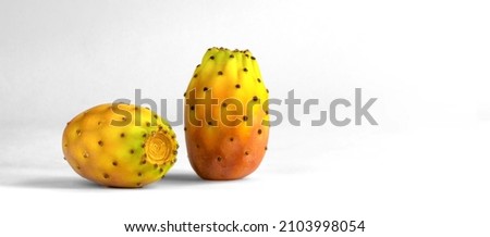 Prickly pear, orange nopal cactus fruit on white background with copy space Royalty-Free Stock Photo #2103998054