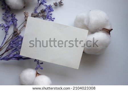card mockup with violet flowers and cotton flowers