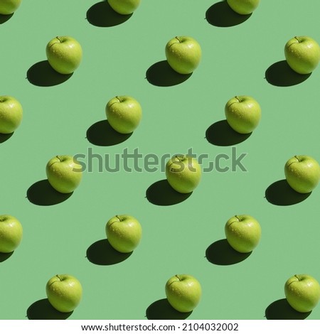 Seamless pattern with a green apple on a green background. Modern style isometric concept