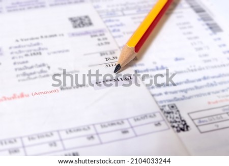 Utility energy bill with pencil blurred background, Bill and saving concept