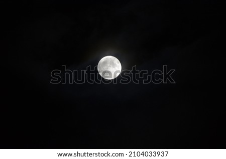 A picture of a moon at night.