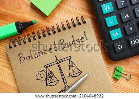 Balanced Budget is shown on a photo using the text Royalty-Free Stock Photo #2104048922