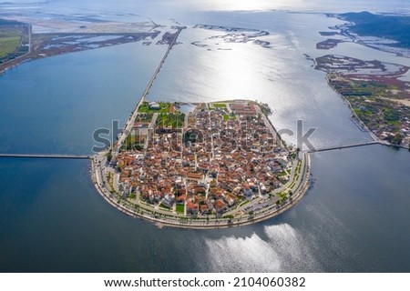 Aerial drone view of the famous island - fishing village of Aitoliko in Aetolia - Akarnania, Greece situated in the middle of Messolongi archipelago known as the Little Venice of Greece Royalty-Free Stock Photo #2104060382