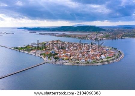 Aerial drone view of the famous island - fishing village of Aitoliko in Aetolia - Akarnania, Greece situated in the middle of Messolongi archipelago known as the Little Venice of Greece Royalty-Free Stock Photo #2104060388