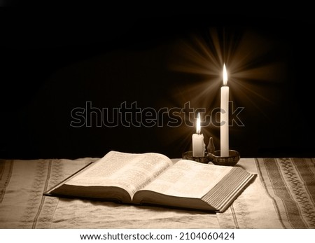 Grunge age dirty rough rustic brown psalm pray torah law letter archiv stack dark black wooden desk table space. New jew culture god Jesus Christ gospel literary art wood still life flame fire concept Royalty-Free Stock Photo #2104060424