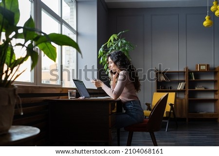 Smiling entrepreneur businesswoman talking on smartphone with colleague discuss business project, financial report or strategy. Cheerful female sales manager communicating with client on cellphone Royalty-Free Stock Photo #2104068161