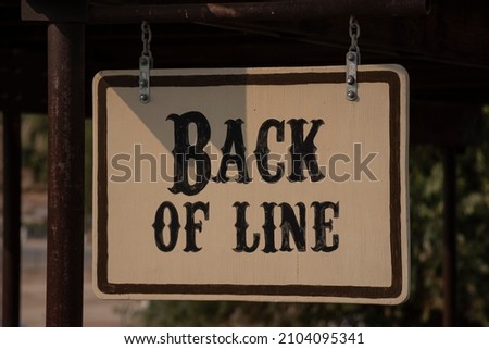 Back of line sign with white background. 