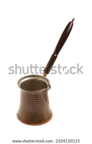 Turkish coffee pot on isolated white background Royalty-Free Stock Photo #2104120121