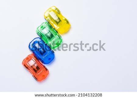 Colorful toy cars on a white background, Electric car