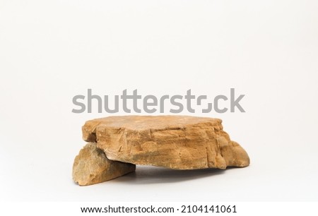 Mock up display shelf,cosmetics,advertising and natural products,brown stone pedestal scene on 3D white background. Advertising and presentation concept. Royalty-Free Stock Photo #2104141061