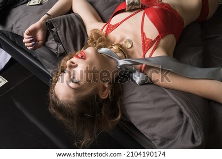 Strangled beautiful woman in the hotel room. Simulation of the crime scene.



