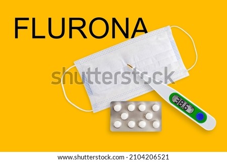 Face masks, thermometer and pills isolated on a yellow background. Covid 19 alpha, beta, gamma, delta, lambda, mu, omicron, flurona variants outbreak around the world.
