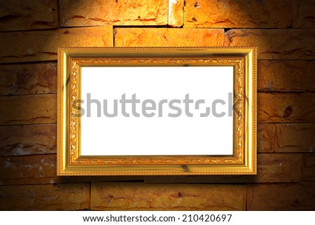 Gold vintage photo frame on wall with light and shadow
