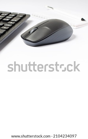 Computer mouse and keyboard on a white background. Copy space