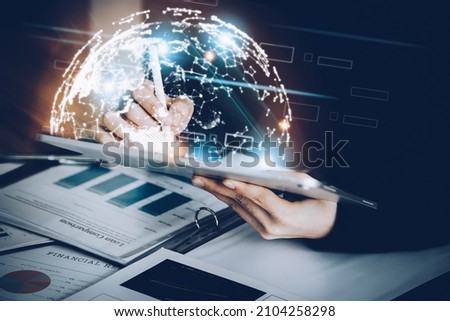 Business woman using a tablet to work through the internet technology for the digital marketing era, data analysis, , big data, Business global internet, global network and data exchanges. Royalty-Free Stock Photo #2104258298