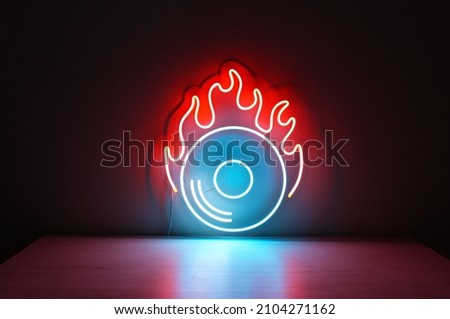 Blue vinyl record sign with orange fire. Neon concept. Modern style. Neon sign. Party background. 