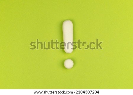 Exclamation mark on a green background. Warning sign, keep attention concept. The alarm about important information.  Royalty-Free Stock Photo #2104307204