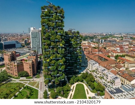 Aerial photo of Bosco Verticale, Vertical Forest, in Milan, Porta Nuova district. Residential buildings with many trees and other plants in balconies Royalty-Free Stock Photo #2104320179