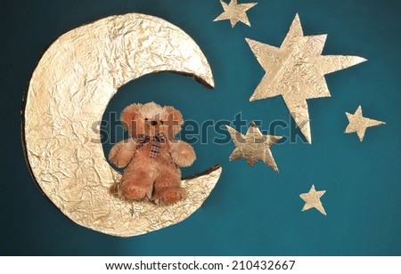 teddy bear on the handmade moon and stars, background