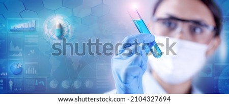 Woman chemist examining a test-tube with blue liquid while working at drugs synthesis in scientific background with data, chart and pill 3d illustration. Royalty-Free Stock Photo #2104327694