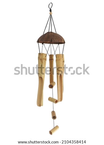 Bamboo wind chime isolated. Mobile chime wind pendant handmade on white background. Oriental style wood wind chime. Home and garden decoration. Relaxing music concept. Royalty-Free Stock Photo #2104358414