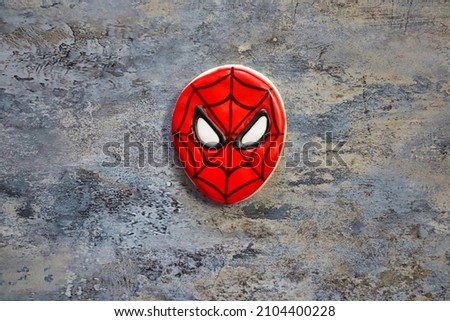 San Diego, CA USA - December 12, 2021: A Spiderman face sugar cookie with royal icing.