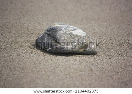 a stone in the sand