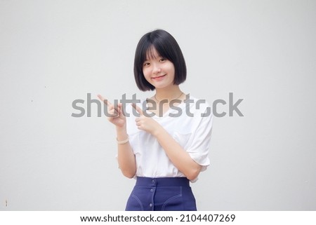 asia thai teen White t-shirt beautiful girl pointing