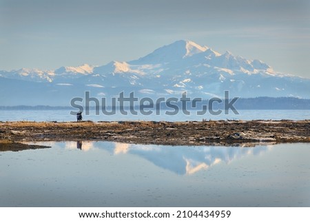 Mt Baker Behind Boundary Bay. The view of Mt Baker from Centennial Beach in Delta, British Columbia, Canada.

                                Royalty-Free Stock Photo #2104434959