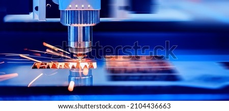 Metallurgy milling plasma cutting of metal CNC Laser engraving. Concept background modern industrial technology. Royalty-Free Stock Photo #2104436663