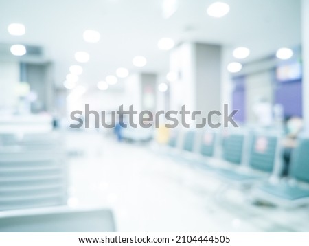 Blurred images of Rows of waiting for chairs in the hospital, Hospital patient transport bed Stainless Steel Emergency Hospital Stretcher Trolley.covid-19 concept. Royalty-Free Stock Photo #2104444505
