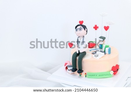 doctor fondant and equipment for doctors on vanilla cake, Homemade cake concept