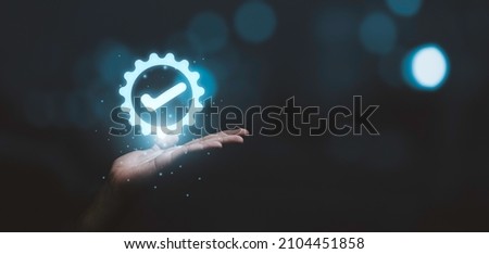 Hand holding and showing the best quality assurance  for guarantee product and ISO service concept. Royalty-Free Stock Photo #2104451858