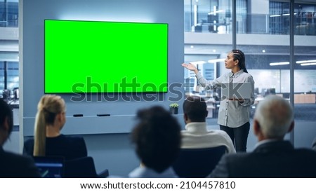 Modern Product Presentation Event: Black Businesswoman Speaks, Uses Green Chroma Key Screen Wall TV. Press Conference for Group of Diverse Investors, Digital Entrepreneurs, Businesspeople