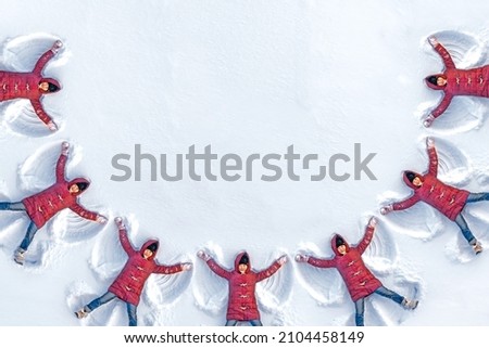 Diagram of a garland of seven children who make a snow angel. The child makes wings from the snow.